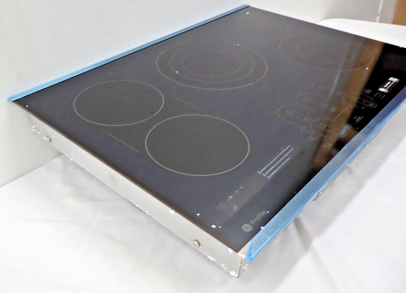 GE Profile PEP9030STSS - 30" Electric Built In Cooktop, Stainless Steel on Black